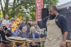 A chef is setting food alight at the Abergavenny Food Festival - BHHL.co.uk