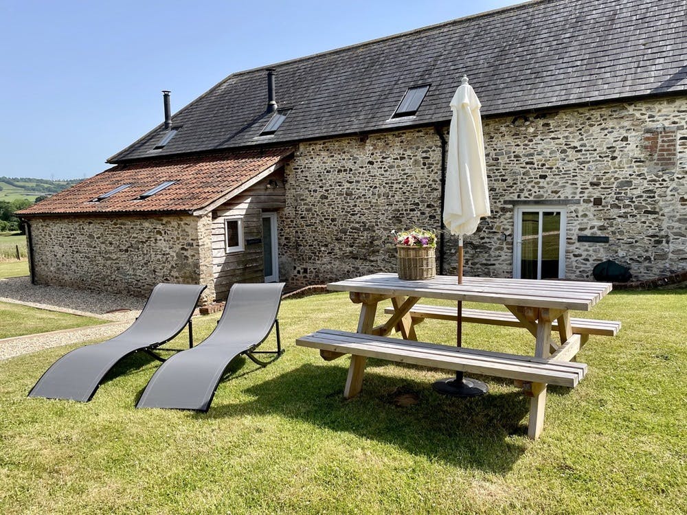 Sun loungers & picnic table at Stonehayes