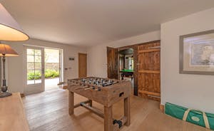 Perys Hill - The Farmhouse: There's table football at one end of the wide hallway 
