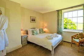 Pound Farm - Bedroom 5: With a view over the walled garden to the field beyond
