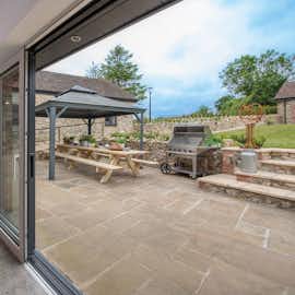 Cricklehaze - Full height doors open from the kitchen area to the patio Cricklehaze - Full height doors open from the kitchen area to the patio