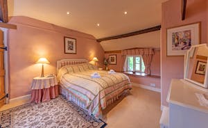 Lower Leigh - The Georgian bedroom has soft pinks for a restful night's sleep