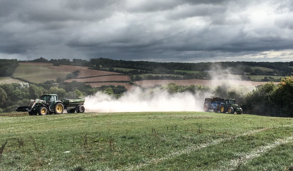 Muck and lime spreading looking spectacular due to the dramatic clouds