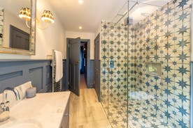 Duxhams - Blue hues in the ensuite shower room for Bedroom 4