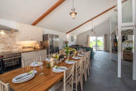Quantock Barns - The Wagon House: The dining area and kitchen to one end of the open plan living space