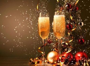 champagne glasses with tinsel and baubles