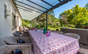 Babblebrook - The veranda runs along the entire length of the house, perfect for outdoor dining