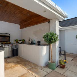 Sampford View - To one side of the pool terrace there's a covered cooking area Sampford View - To one side of the pool terrace there's a covered cooking area