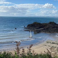 Wonderful view of a sandy beach, clear sea and rocks on Hope Cove