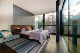 The Glass House on the Lake - Bedroom 2: All bedrooms have electronically operated blinds