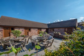 Quantock Barns - All barns are accessed via a paved courtyard, with outdoor seating and a big built in barbecue