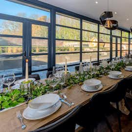 Hunky-Dory - The glass walled dining room overlooks the garden Hunky-Dory - The glass walled dining room overlooks the garden