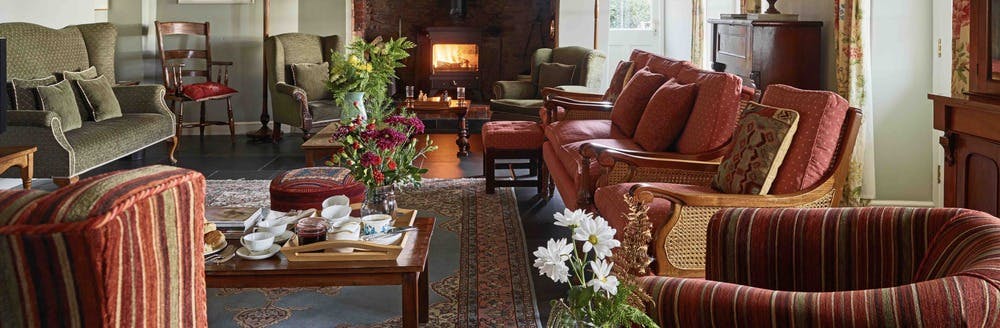 Afternoon tea being served in the sitting room.