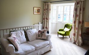 Relax in the upstairs sitting room with bay window over the High Street