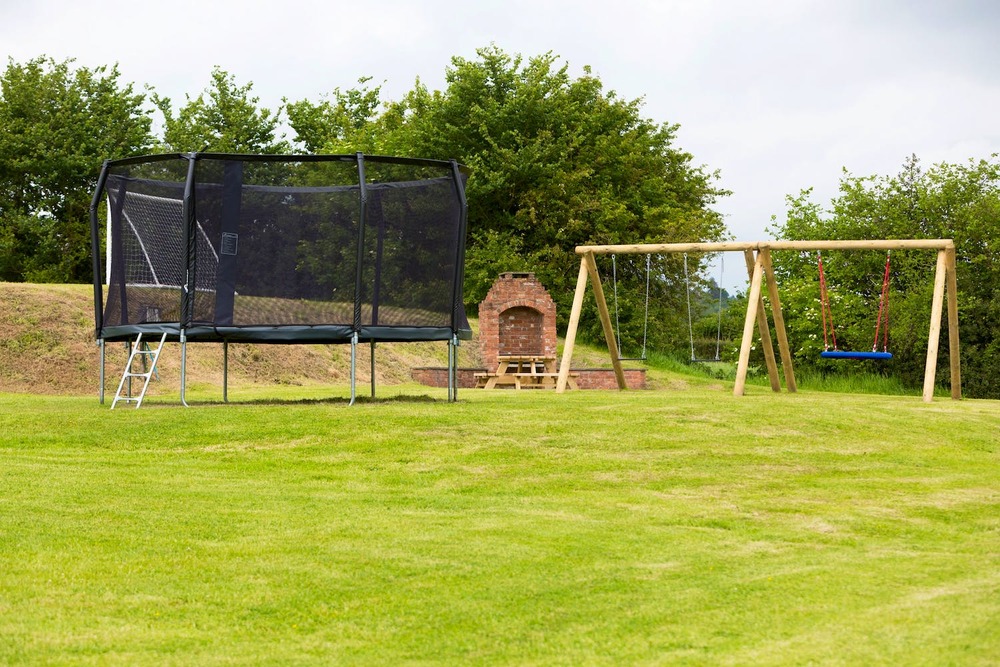 Outdoor play area at Stonehayes Farm