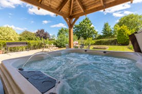 The Plough - The covered hot tub can be used anytime of year