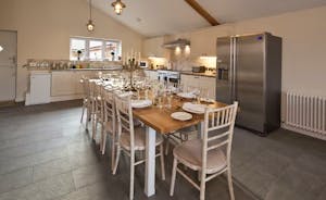 Quantock Barns - The Wagon House: The dining area and kitchen to one end of the open plan living space