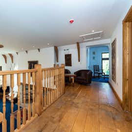 Minstrel Gallery walkway over looks the lounge and leads to bedroom The Manor on the Monnow Holiday accommodation sleeping 24 in Monmouthshire www.bhhl.co.uk   Minstrel Gallery walkway over looks the lounge and leads to bedroom The Manor on the Monnow Holiday accommodation sleeping 24 in Monmouthshire www.bhhl.co.uk