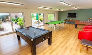 Orchard House games room with pool, table tennis big picture windows onto the terrace. Family and friends entertainment www.bhhl.co.uk 