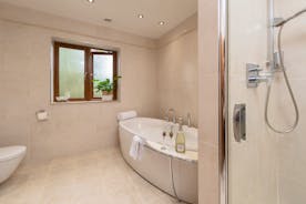 Hamble House - The shared bathroom for Bedroom 4 and 5 has a modern free standing bath and a separate shower