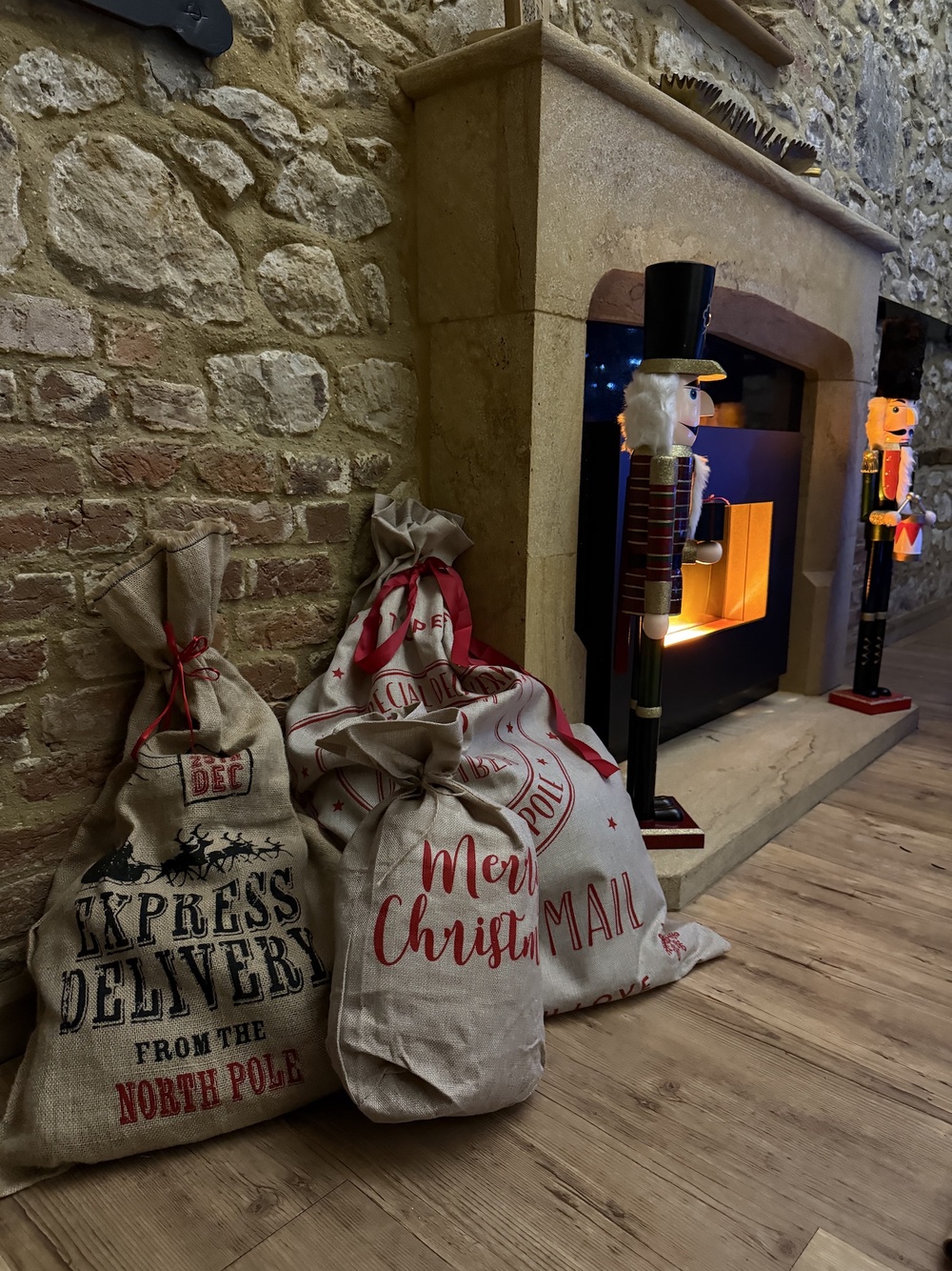 Christmas stockings next to the fireplace in Beaverbrooks cosy living room