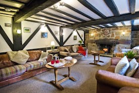 Sitting Room with comfy sofas  & rustic charm for large group accommodation  The Anchor Forest of Dean Gloucestershire www.bhhl.co.uk