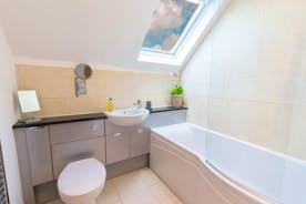 Siskins Nook, Stonehayes Farm - The bathroom has a P-bath with an overhead shower