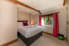 Dancing Hill - Bedroom 4: A pretty room with an outlook over the front garden and the countryside beyond