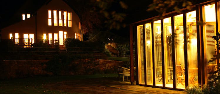 The Cottage Beyond and Spa Hall at night.