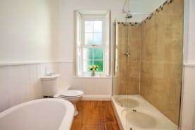 Sandfield House - The main bathroom has a roll top bath and a big shower