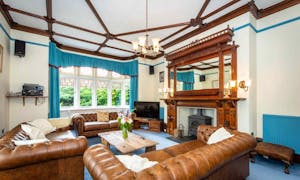 Leather Chesterfields, log burner and feature fire place at  Fairlea Grange family and friends self catering accommodation www,bhhl.co.uk