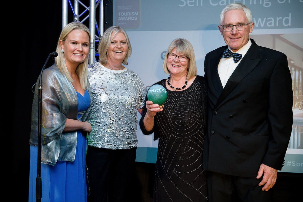 Christine & Alan being presented with the Gold Award for Self-catering at The Bristol, Bath & Somerset Awards
