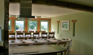 Orchard House large dining room with tables set for dinner  large self catering accommodation Monmouthshire wwww.bhhl.co.uk