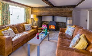 Frog Street: A cosy sitting room with a big old inglenook and a wood-burner