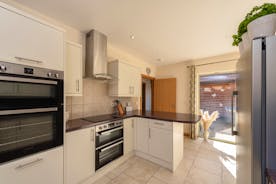 Crowcombe: The kitchen is crisp and modern, equipped with all you need for your stay