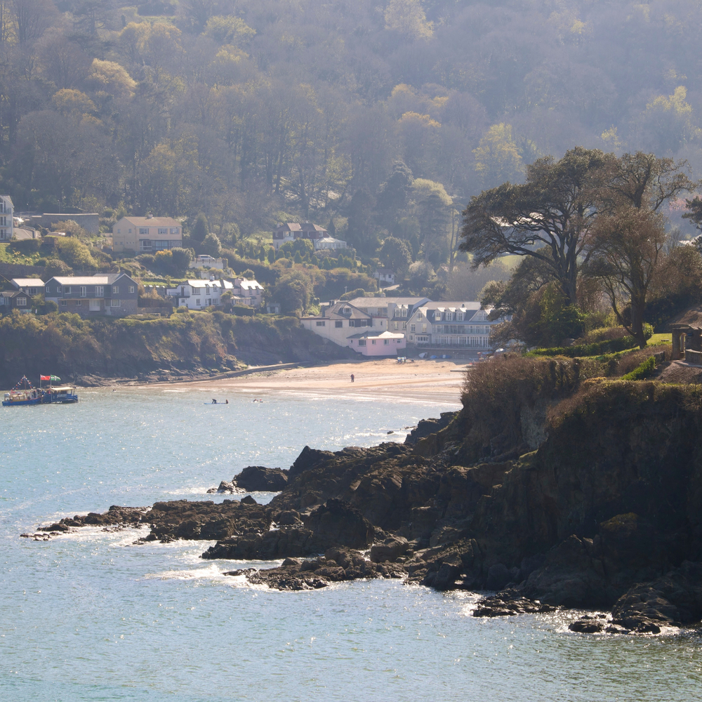 Great view of the flat, sandy beach and steep hills and cliffs of South Sands