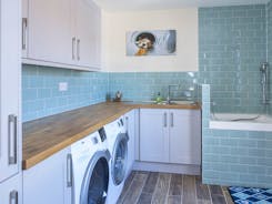 Utility with built in washing machine, tumble dryer and dog shower!
