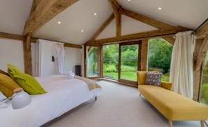 Otterhead House - Bedroom 1: Soaring timbers, breathtaking views