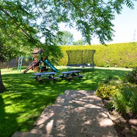 Millgrove House: The secure garden has a play area, so the young 'uns will be happy Millgrove House: The secure garden has a play area, so the young 'uns will be happy