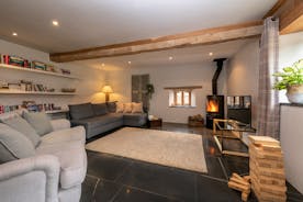 Court Farm - The Cottage: A light and airy living room with a wood-burner for the chillier times of year