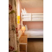 Room with two singles and bunk beds