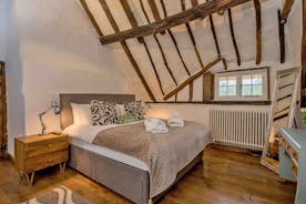 Pinklet - Bedroom 3: centuries old rafters soar to the apex (this room is now carpeted)