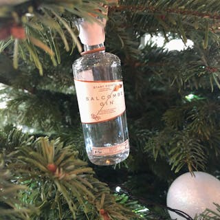 Locally produced gin hanging off a Christmas tree
