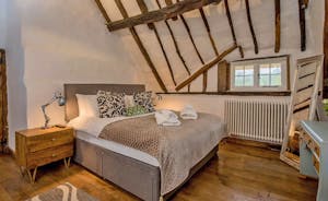 Pink Thatch - Bedroom 3: centuries old rafters soar to the apex (this room is now carpeted)