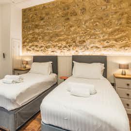 Another photo of bedroom 7 with its characterful stone back wall. Another photo of bedroom 7 with its characterful stone back wall.