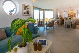 Tides Reach - In the middle of the kitchen/living room, full height doors open to the balcony 
