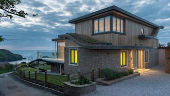 Runic House with a stunning view of the coast behind