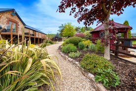 Foxhill Lodge - Landscaped gardens with a pool, play area and BBQ lodge