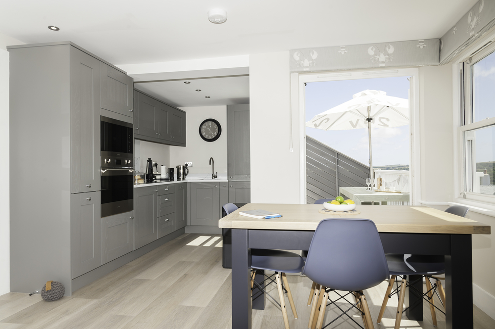 Modern looking kitchen with windows looking out at stunning views