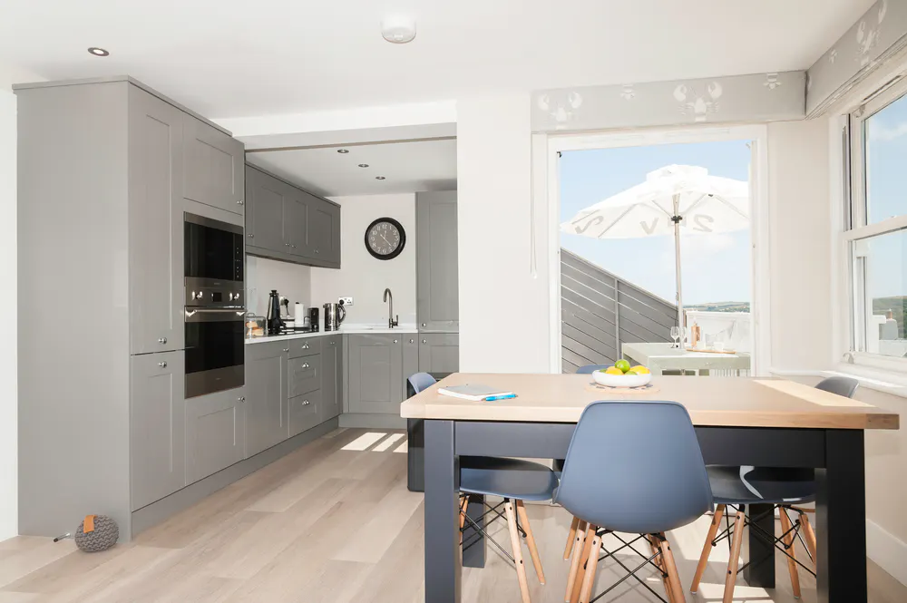 Modern looking kitchen with windows looking out at stunning views